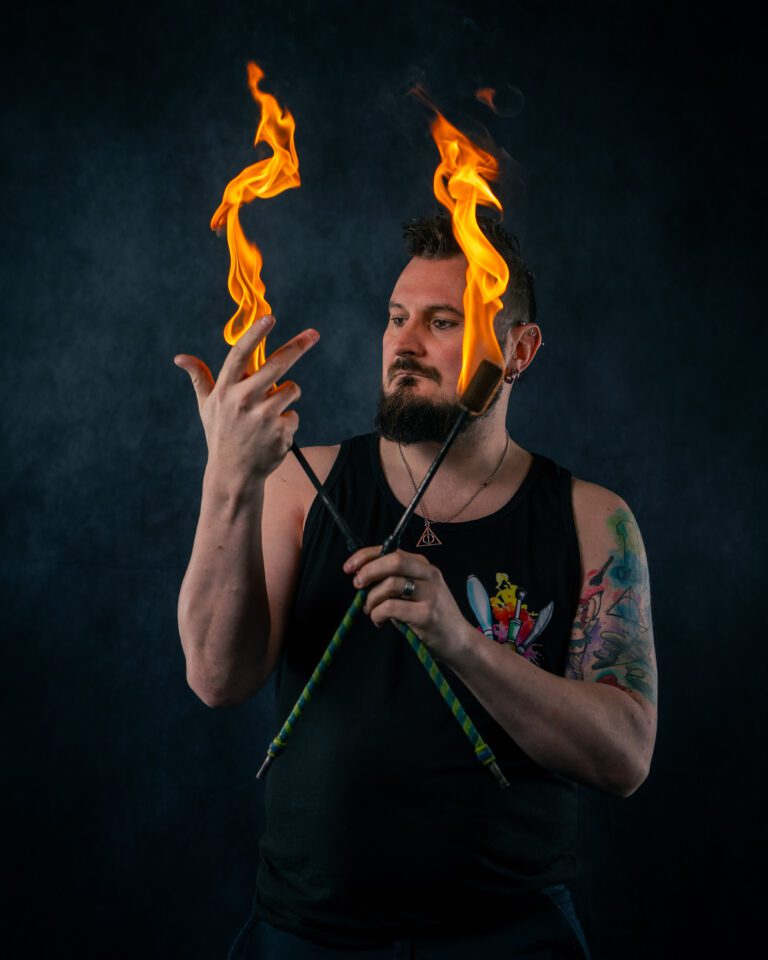 Fire eating instructor demonstrating vapour manipulation at a workshop