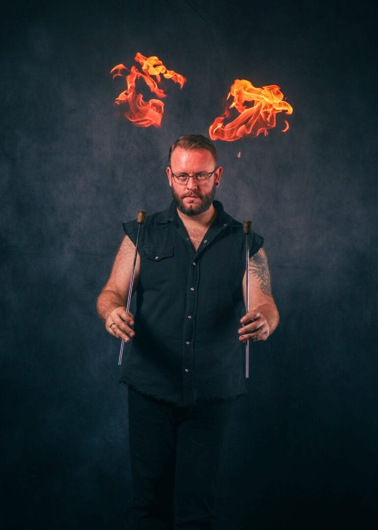 Workshop attendee practising fire manipulation techniques