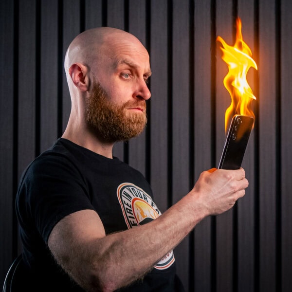 Student learning fire eating at Fire In Your Face Academy